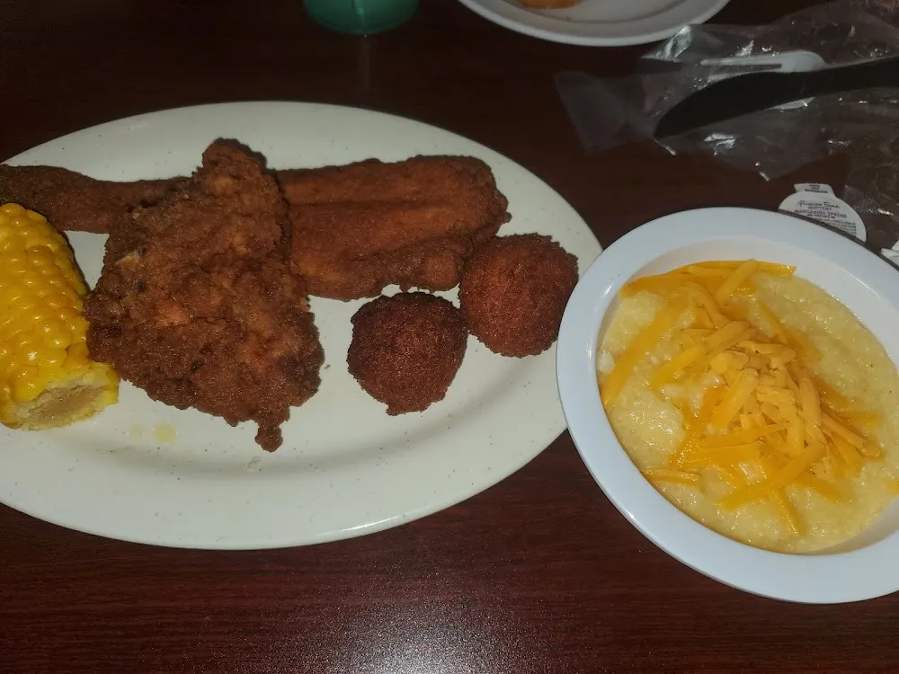 Fish Chicken Hushpuupies Corn on Cobb Cheese Grits